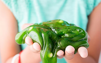 Green Slime oozing from little girls hands