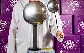 Mad Scientist experimenting with a Van de Graaff generator.