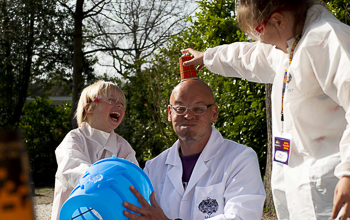Mad Scientist with a cup on his head getting ready for an Airzooka demonstration.
